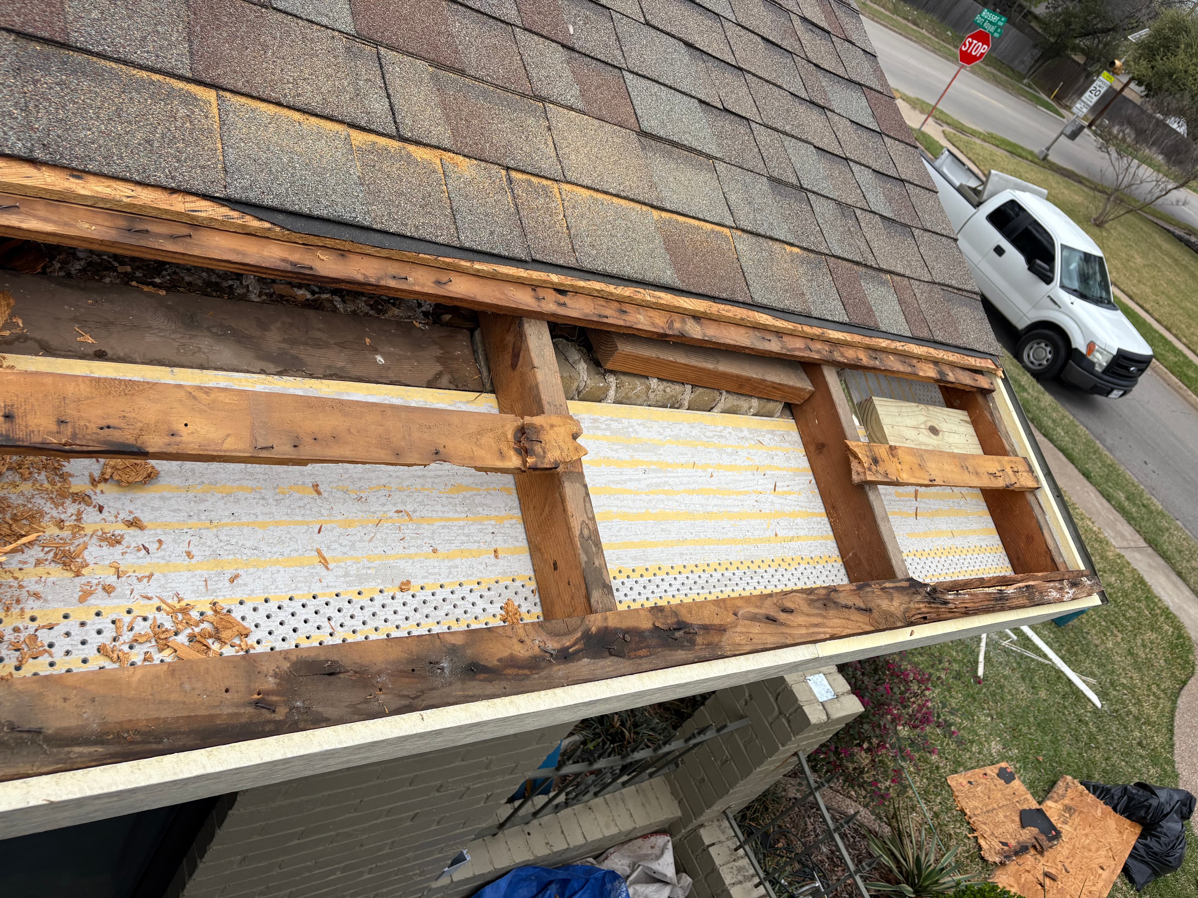Second before photo of Dallas roofline repair area.