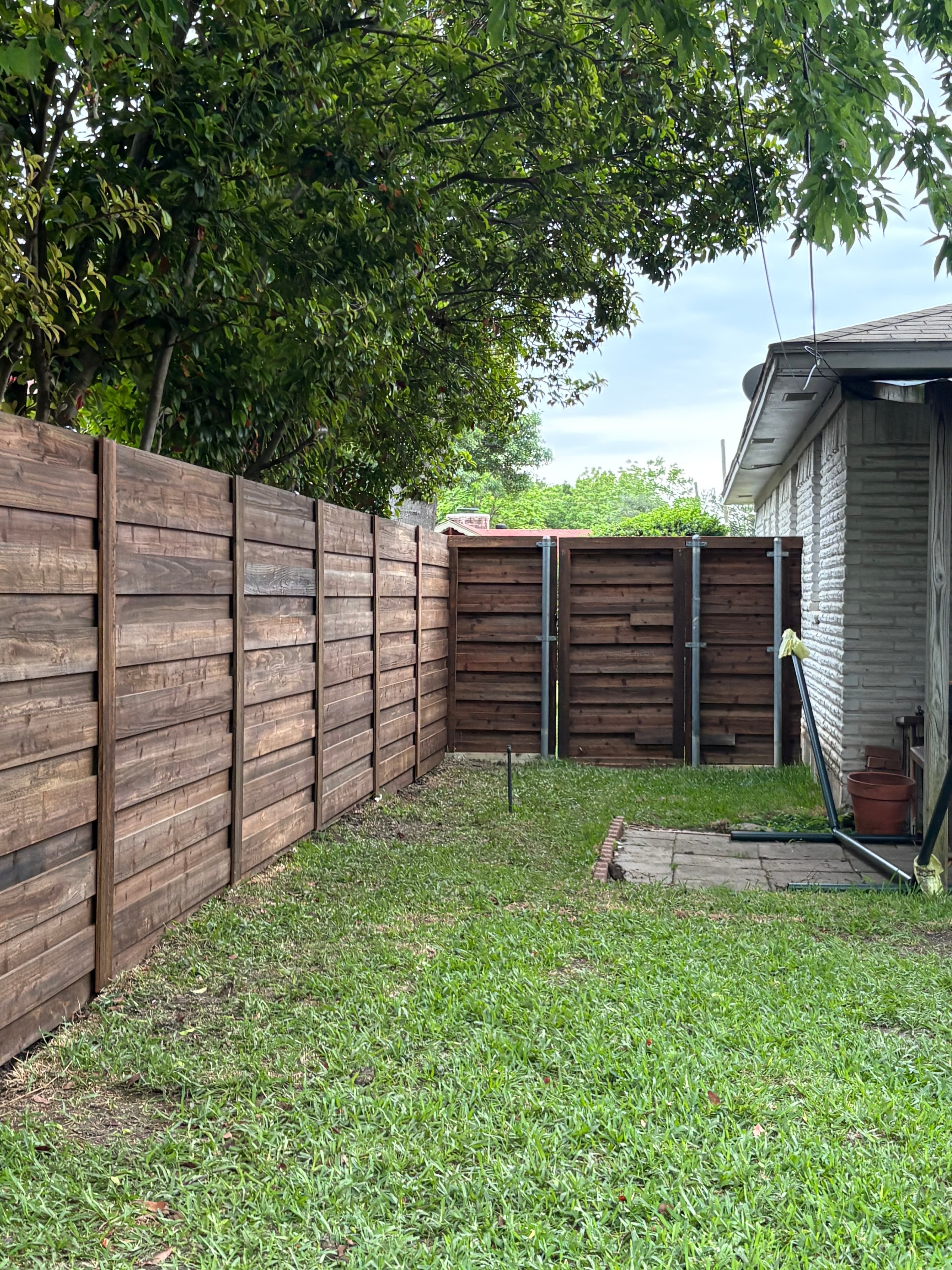 After photo of completed Richardson fence entrance replacement.