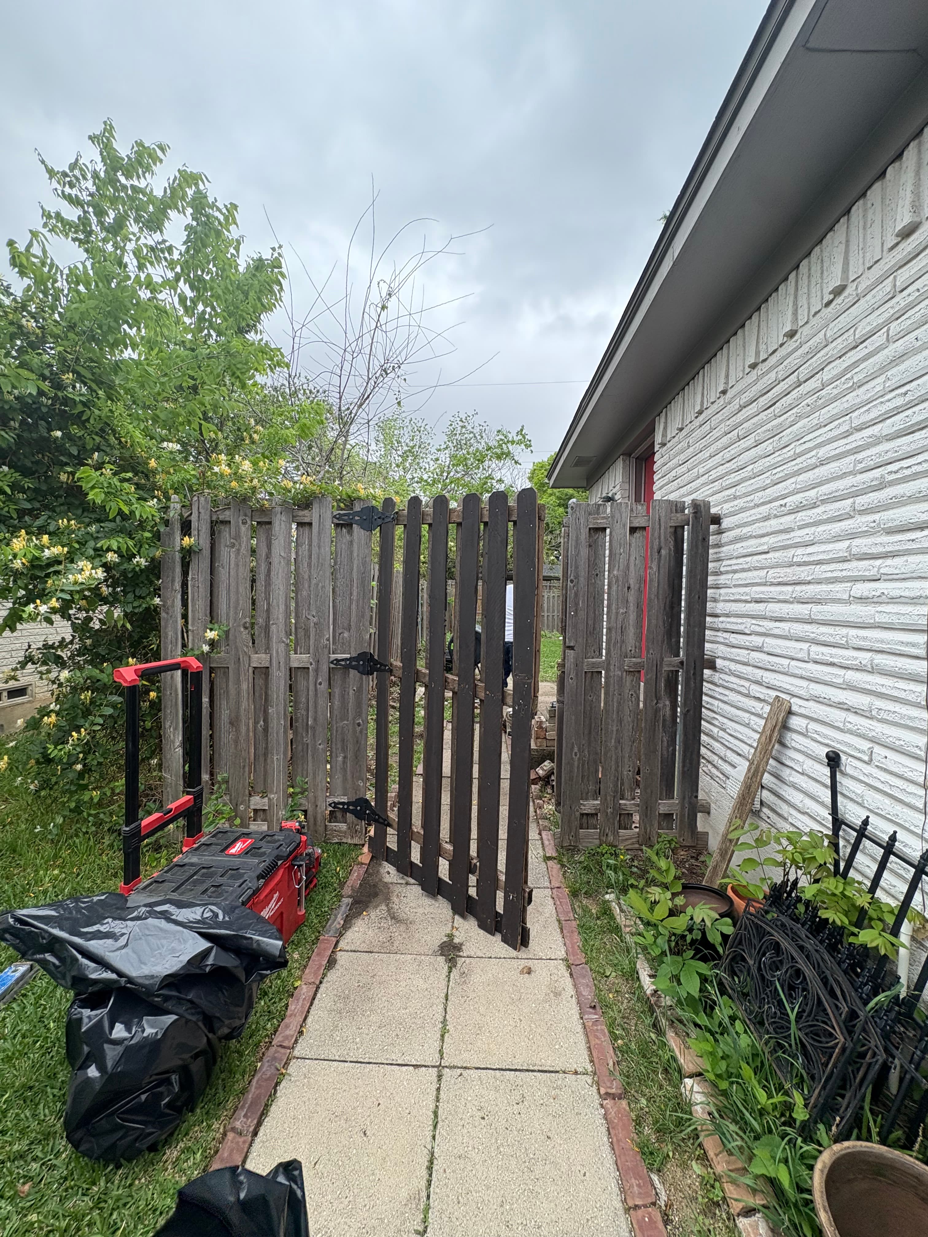 Before photo of Richardson fence entrance before replacement.