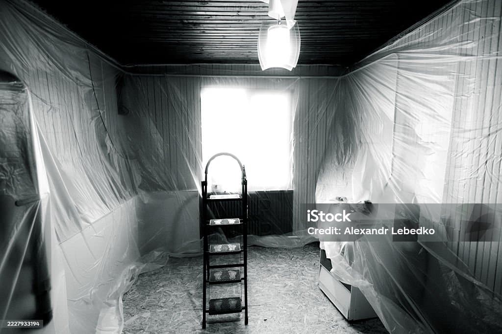 Professional preparation work with plastic sheeting protecting the home